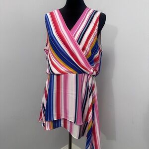 Colorful tunic, pullover style. Peplum cut with float detail at the bottom